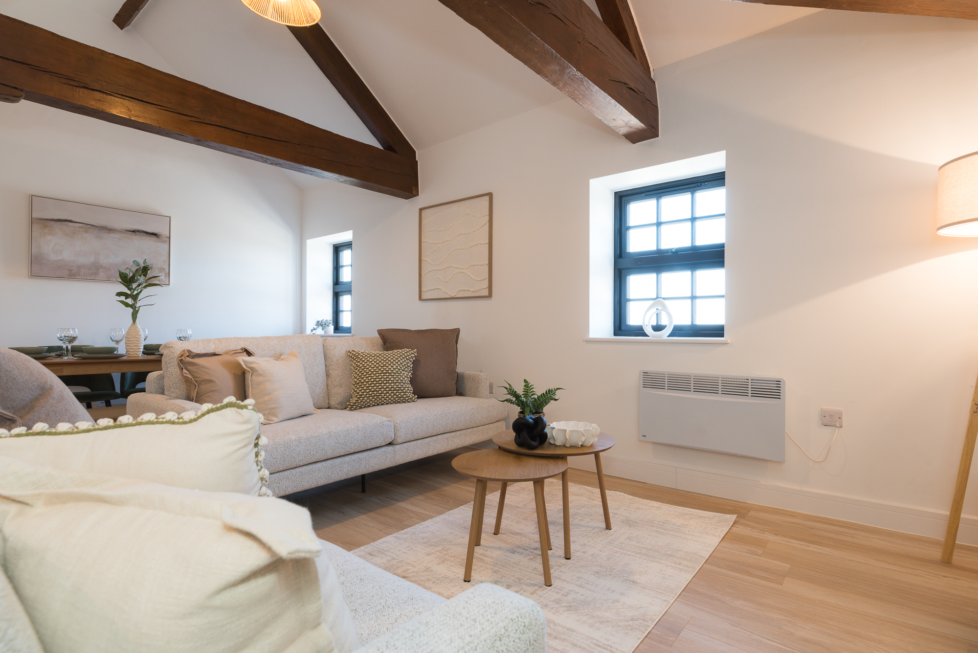 Bright, cosy barn-conversion living room at The Old Mill, a Renzo-managed short-let property in the UK